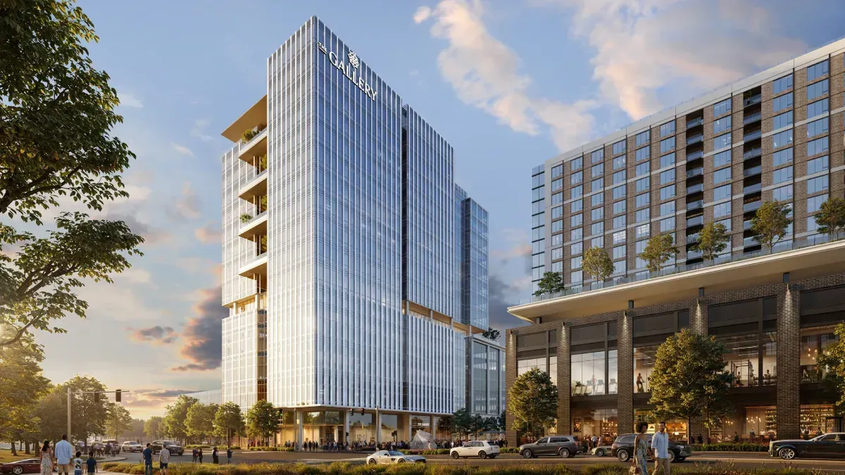 Architectural rendering of "The Gallery," a modern glass skyscraper with stacked open-air balconies, situated next to a multi-story building with a ground-level retail plaza during late afternoon.